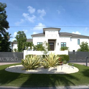 Modern white house with gray roof, gated driveway, circular landscaped entrance, and tropical plants in front.